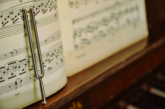 tuning fork and piano sheet