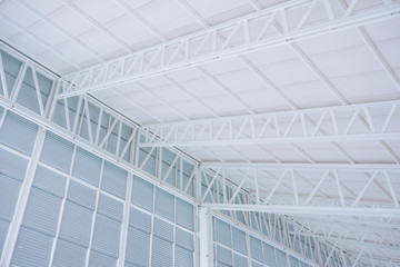 Obraz premium Large steel structure truss, roof frame and metal sheet in building construction site