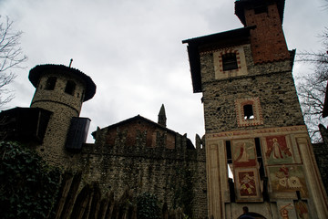 Towers of Medieval castle from red rocks or stones