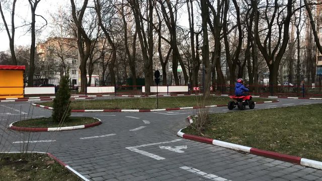 Little girl goes karting in public park