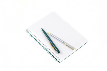 notebook with a pen on a white background