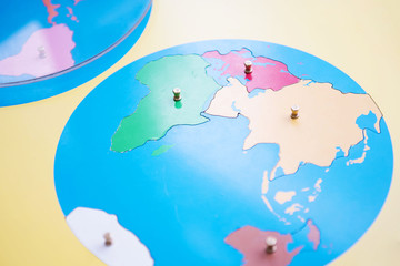 Montessori Education. Montessori School. Learning materials in a montessori methodology school. Puzzle with map.