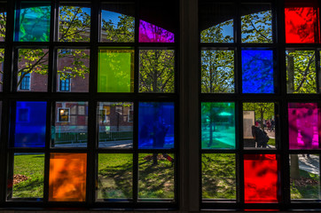 colored stained-glass windows illuminated by the sun's rays