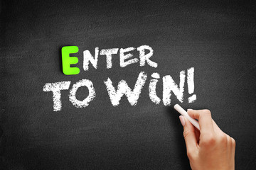 Enter to win text on blackboard, education business concept background