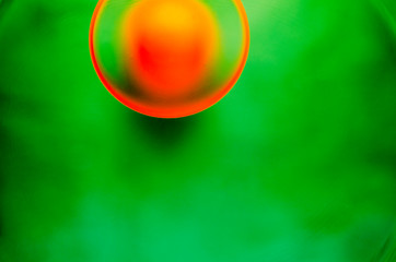 orange ball on green background with shadow