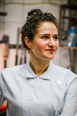 Obraz premium Portrait of Chef's Girl. In the kite in the kitchen.