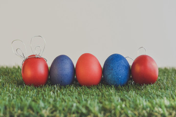 Easter eggs on green background