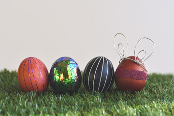 Easter eggs on green background