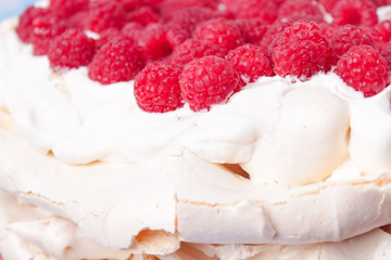 pavlova cake with raspberries and whipped cream