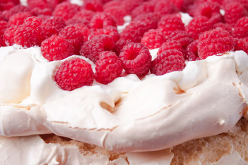 pavlova cake with raspberries and whipped cream