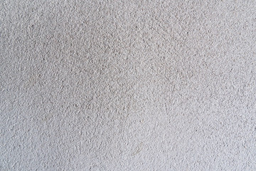 Texture of concrete wall surface painted with white color. Suitable for use as a pattern or background image for use in graphic design.