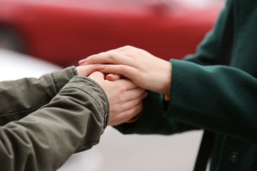 Young woman comforting her friend outdoors