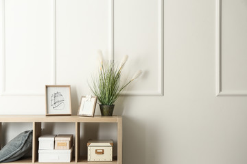 Modern shelf unit near white wall