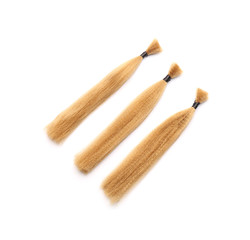 Hair strands on white background. Concept of donation