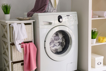 Washing machine in modern home laundry room