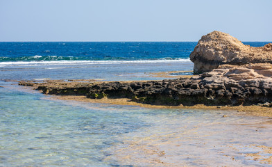 Rocks in the sea at the entrance to Coraya Bay in Egypt.