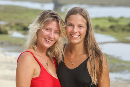 Headshot of two beautiful happy girls, outdoor image with a natural light