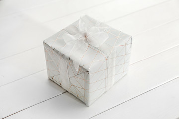 Gift box on white table