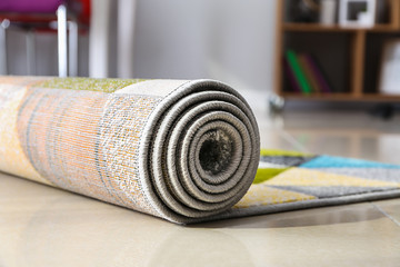 Rolled carpet on floor in room