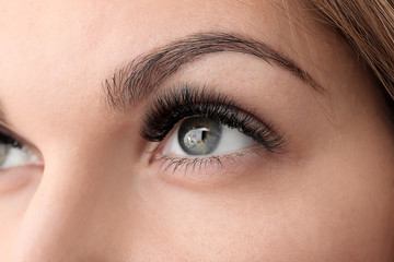 Young woman with beautiful eyelashes, closeup