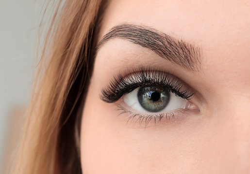 Young woman with beautiful eyelashes, closeup
