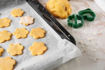Baking sheet with raw cookies on light table