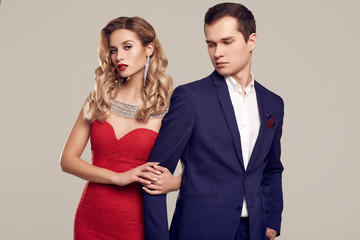 Sensual beautiful young couple dressed in formal clothes