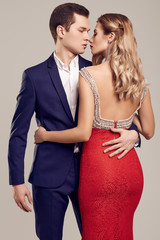 Sensual beautiful young couple dressed in formal clothes