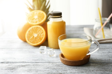 Glass cup of orange juice on table