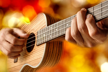 Obraz premium playing a tenor ukulele