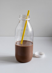 Lactose free chocolate oat milk in a plastic bottle.