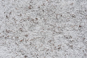 Wall fragment with scratches and cracks