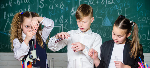 Science is worth exploring. Lab microscope and testing tubes. biology experiments with microscope. Little kids scientist earning chemistry in school lab. Chemistry science. Little children. Science