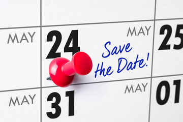 Wall calendar with a red pin - May 24