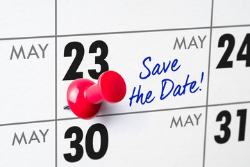 Wall calendar with a red pin - May 23