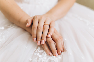 Tender elegant hands of cute pretty bride in wedding fashion dress. Wedding  fashionable concept