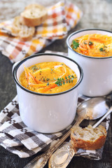 Vegetable carrot soup and bread, two portions