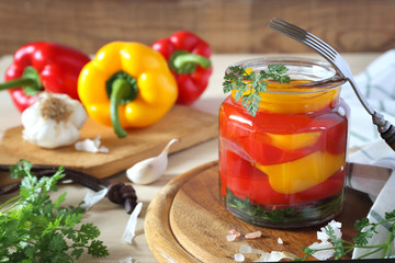 Pickled salad bell pepper in jar and ingredients