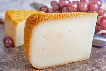 French yellow cheeses, Pur Brebis sheep melk cheese fron Pyrenees and Saint Paulin creamy, mild, semi-soft French cheese from pasteurized cow milk