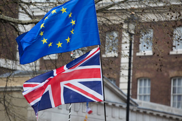 European Union and British flags fly together at an anti-Brexit political march