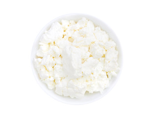An overhead photo of fresh natural cottage cheese in a white ceramic bowl isolated on white. Organic eco healthy meal, dairy product. Top view.
