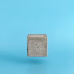 Levitating cube pedestal on blue background. Stand for your design or text.