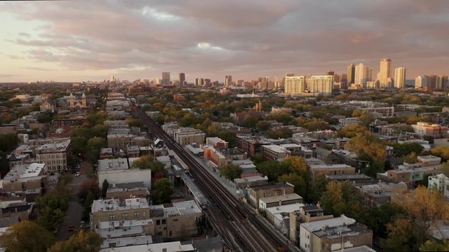 Subway Passing through Urban Neighborhood- 4k Aerial Cinematic