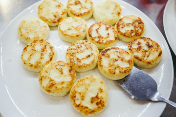 A large plate with curd cheese for breakfast, Cottage cheese pancakes, curd fritters with fresh berries strawberries