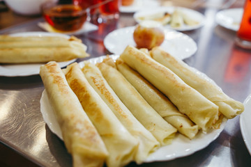 Pancakes with cheese are served with honey