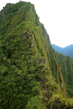 Group Of Visitors Hiking The Huayna Picchu Mountain At Machu Picchu Historic Site In Cusco Region, Peru