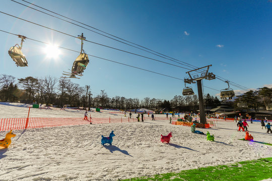People to play ski ,snowboard and cable car at ski resort in winter on holiday of Nagano Prefecture, Japan..