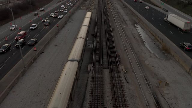 Subway Heading towards city - 4k Aerial