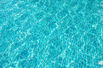Waving blue water surface. blue clear fresh Water in jacuzzi.