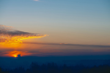 Sunny shine on clouds. Wonderful vivid dawn. Beautiful calm sunset. Scenic tranquil sunrise. Amazing peaceful cloudy sky. Sun above horizon. Picturesque sundown. Atmospheric cloudscape. Background.